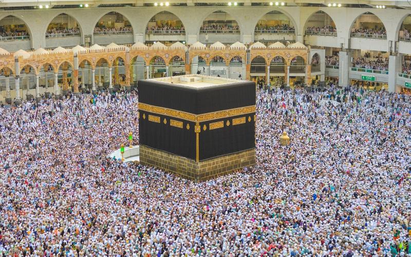 Kaaba in Makkah with crowd of Muslim people all over the world praying together