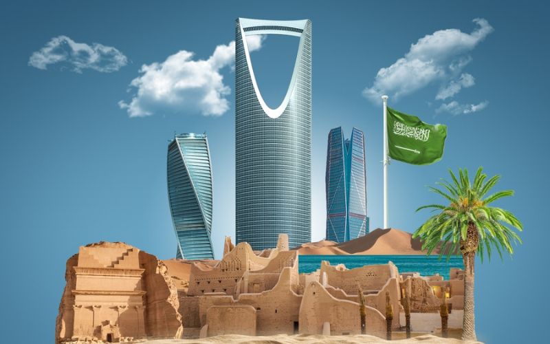 Saudi Arabian cultural heritage site with modern cityscape in the background